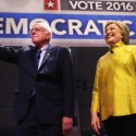 Clinton Clings to Obama in Democratic Debate