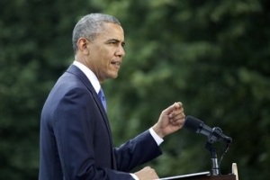 President Barack Obama gives a speech on the White House lawn Friday, June 13, 2014.